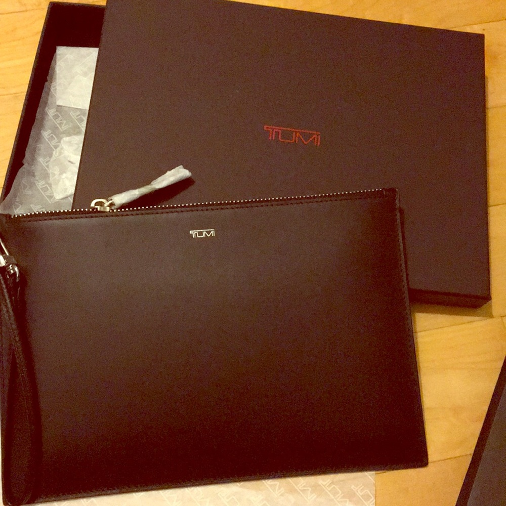 Never worn Tumi black wristlet